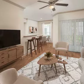 Open concept living room with direct access to patio at Camden Midtown Apartments in Houston, TX