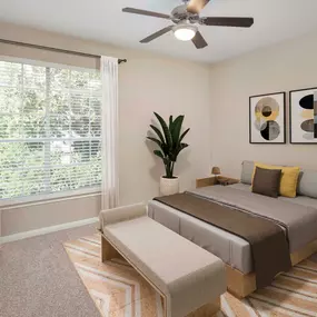 Townhome bedroom with carpet and ceiling fan at Camden Midtown Apartments in Houston, TX.