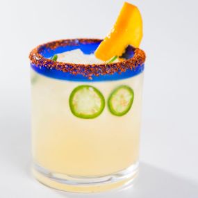 A hot spin on a classic: the Spicy Mango Margarita! Made with 1800 Silver, mango, fresh lime, jalapeño, and chile lime salt.