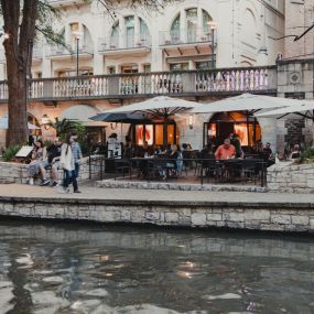 Dine in the restaurant or on the patio with a view of the River Walk, boats and the famous Selena Bridge.