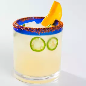 A hot spin on a classic: the Spicy Mango Margarita! Made with 1800 Silver, mango, fresh lime, jalapeño, and chile lime salt.