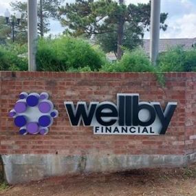 Exterior signage of Wellby Financial in Friendswood