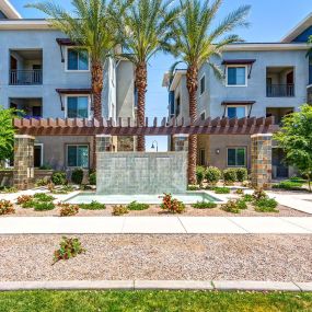 Courtyard water feature with landscaped walkways and benches