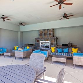 Outdoor resident lounge seating and fireplace