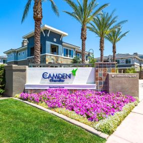 Landscaped flowers and grass near leasing office monument sign