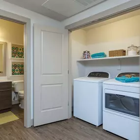 Full size washer and dryer with laundry shelves