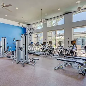 24-hour fitness center with strength training equipment and cardio machines