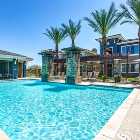 Resort style pool with outdoor lounge and dining areas