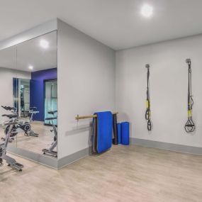 Yoga room with TRX training and spin bikes