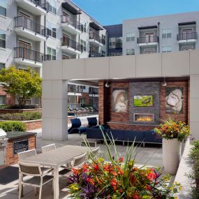 Outdoor lounge with BBQ grills at Camden Buckhead Square apartments in Atlanta, GA