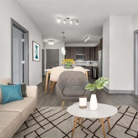 Open-concept living area with hardwood-style flooring and track lighting