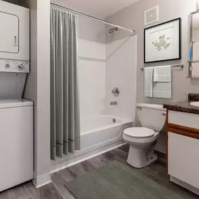 Washer/Dryer and Bathroom with bathtub