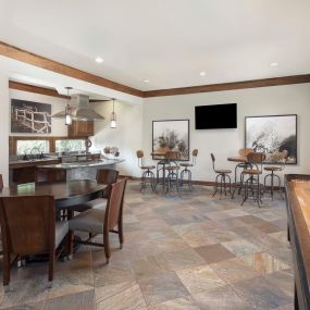 Resident clubhouse with shuffle board and kitchen at Camden Cedar Hills