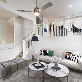 Multi level townhome living room with ceiling fan and high ceilings