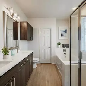 Townhome bathroom with two sinks, walk-in shower and bathtub at Camden Cedar Hills