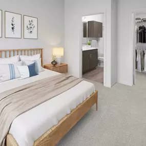 Bedroom with plush carpet, walk-in closet and ensuite