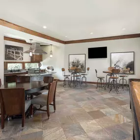 Resident clubhouse with shuffle board and kitchen at Camden Cedar Hills