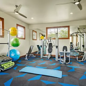 Fitness center strength machines and yoga area