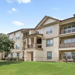 Building exterior showing private patios and balconies