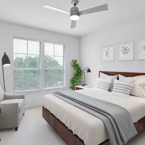 Bedroom with ceiling fan, plush carpet and large windows