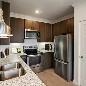 Townhome kitchen with stainless steel appliances at Camden Cedar Hills