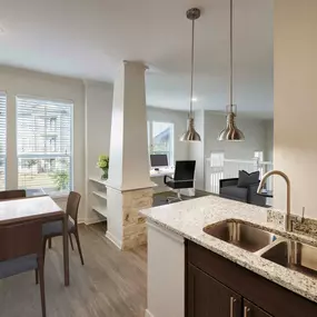 Townhome kitchen dining and home office space with large windows