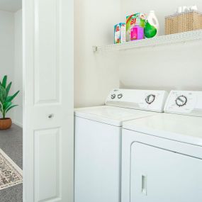 Full size washer and dryer with shelving