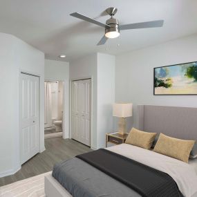 Bedroom with lighted ceiling fan and ensuite