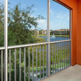 Balcony overlooking lake with water feature