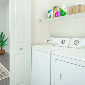 Full size washer and dryer with shelving