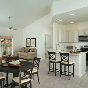 Open concept kitchen with vaulted ceiling balcony