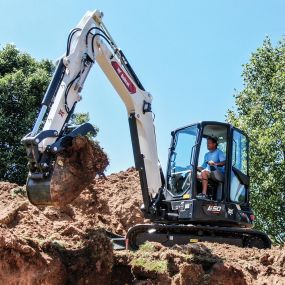 Bobcat E50 digging a trench