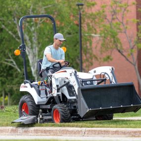 The Bobcat CT1025 with bucket and mid-mount mower