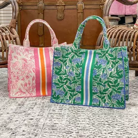 ???? These tote bags are a spring must have!! Only TWO in stock of each color! Shop in store Tues-Sat 10-5 or online at www.shopbarrons.com.