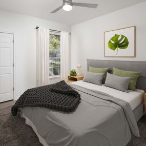 Bedroom with natural lighting and ceiling fan at Camden Vanderbilt in Houston, Texas