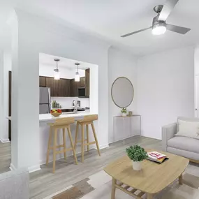 Open concept living space with bar seating at Camden Vanderbilt Apartments in Houston, TX