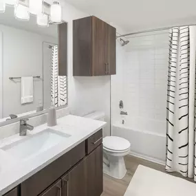 Bathroom with gray quartz countertops at Camden Vanderbilt in Houston, Texas