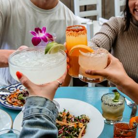Cheers with great Tex Mex on our patio!
