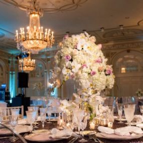 Interior of the historic Brown Hotel ballroom showing a wedding center piece on a table in Louisville.