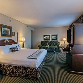 King Accommodation. Sideview of one of our downtown king guest rooms at The Brown Hotel with seating area