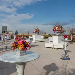 White tables on the rooftop at The Brown Hotel