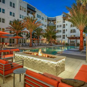 Outdoor Fireside Seating by the Pool at Aurora Luxury Apartments in Downtown, Tampa FL