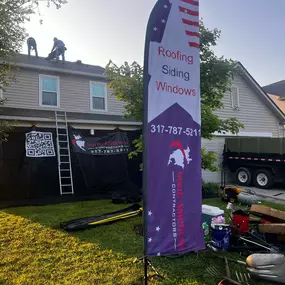 Using our Catch All System to protect the homeowner's lanscaping during a shingle roof replacement.