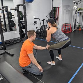 If you experience knee pain when squatting, chances are you are loading your knees instead of your hips. Try keeping a vertical shin to help fix it.