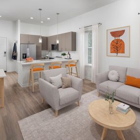 Modern Finish open concept living room with breakfast bar at Camden Lakeway Apartments in Lakewood, CO