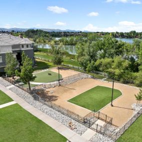 Aerial view of the small and big fenced in dog parks at Camden Lakeway Apartments in Lakewood, CO