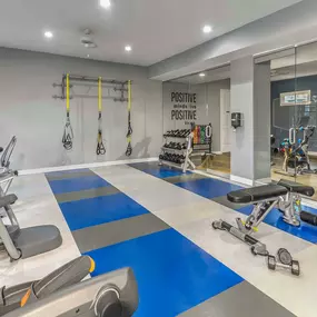 Fitness center with free weights and cardio equipment