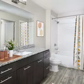 Bathroom with a lot of counterspace and storage at Camden North Quarter apartments in Orlando, FL