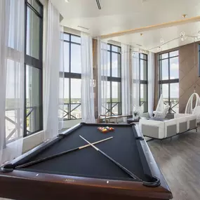 Sky lounge with pool table at Camden North Quarter apartments in Orlando, FL