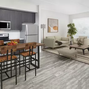 L-shaped kitchen with stainless steel appliances at Camden North Quarter apartments in Orlando, FL